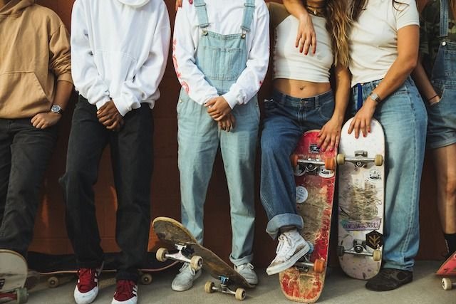 skaters style, wearing baggy jeans, adidas and vans sneakers 