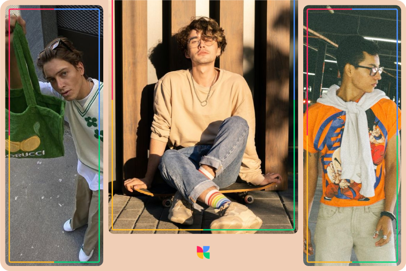 Three men in trendy outfits: one with a green tote bag, one sitting on a skateboard in a beige sweater and jeans, and one in a cartoon print T-shirt with a sweater over his shoulders