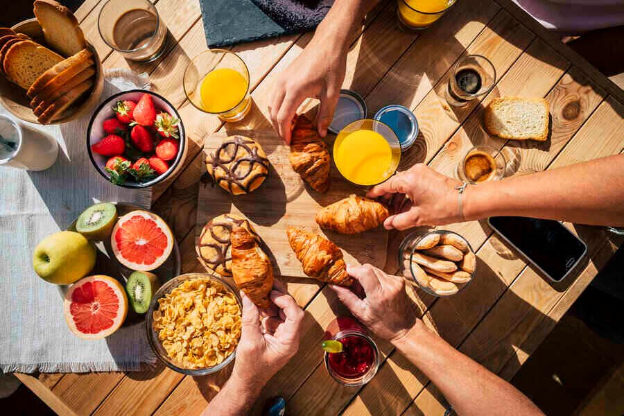Vertical view of table full of breakfast food for instagram growth