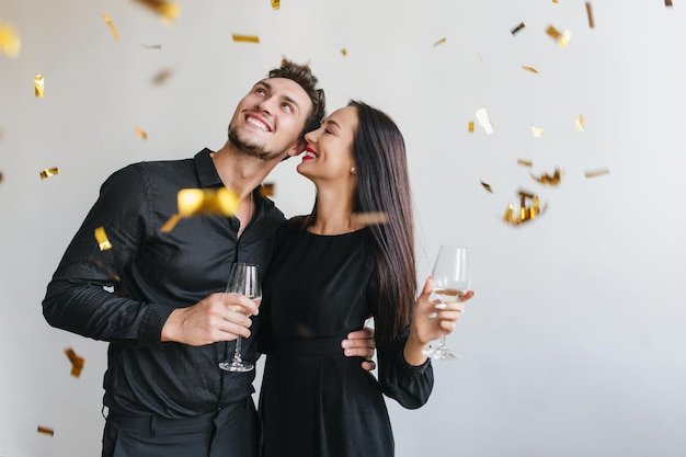 a couple in a black outfit celebrating their anniversary