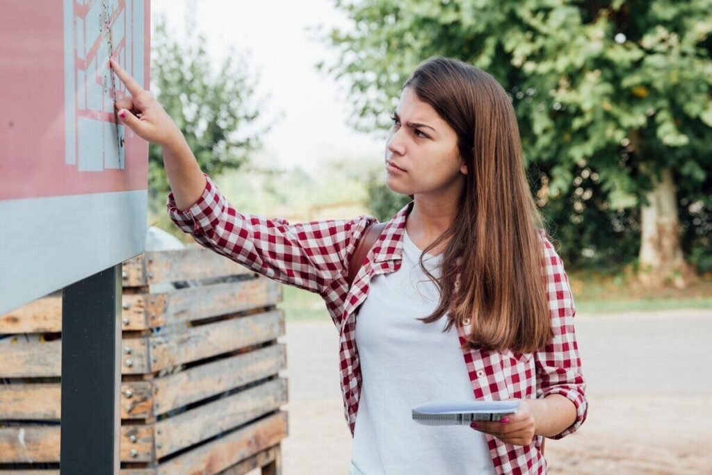 young girl checking city markers