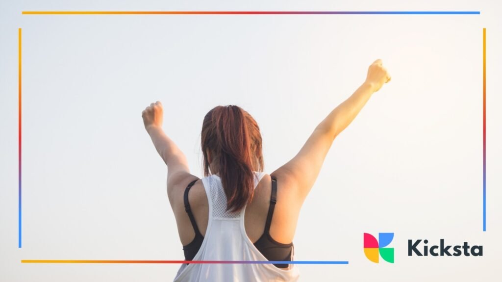 Fitness motivation with woman raising arms