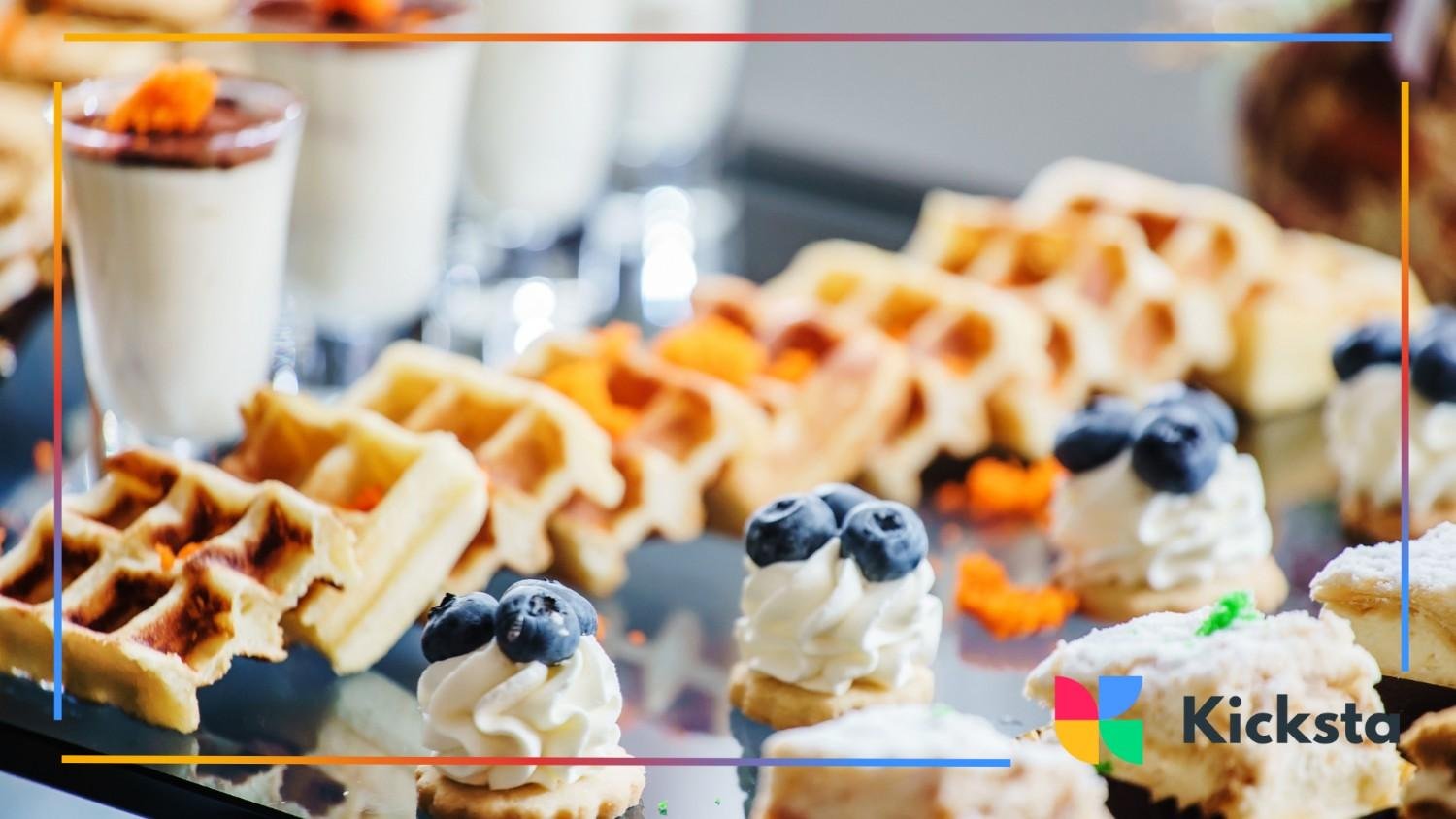 An elegant display of waffles, cream, and fruit, ideal for showcasing a decadent brunch experience
