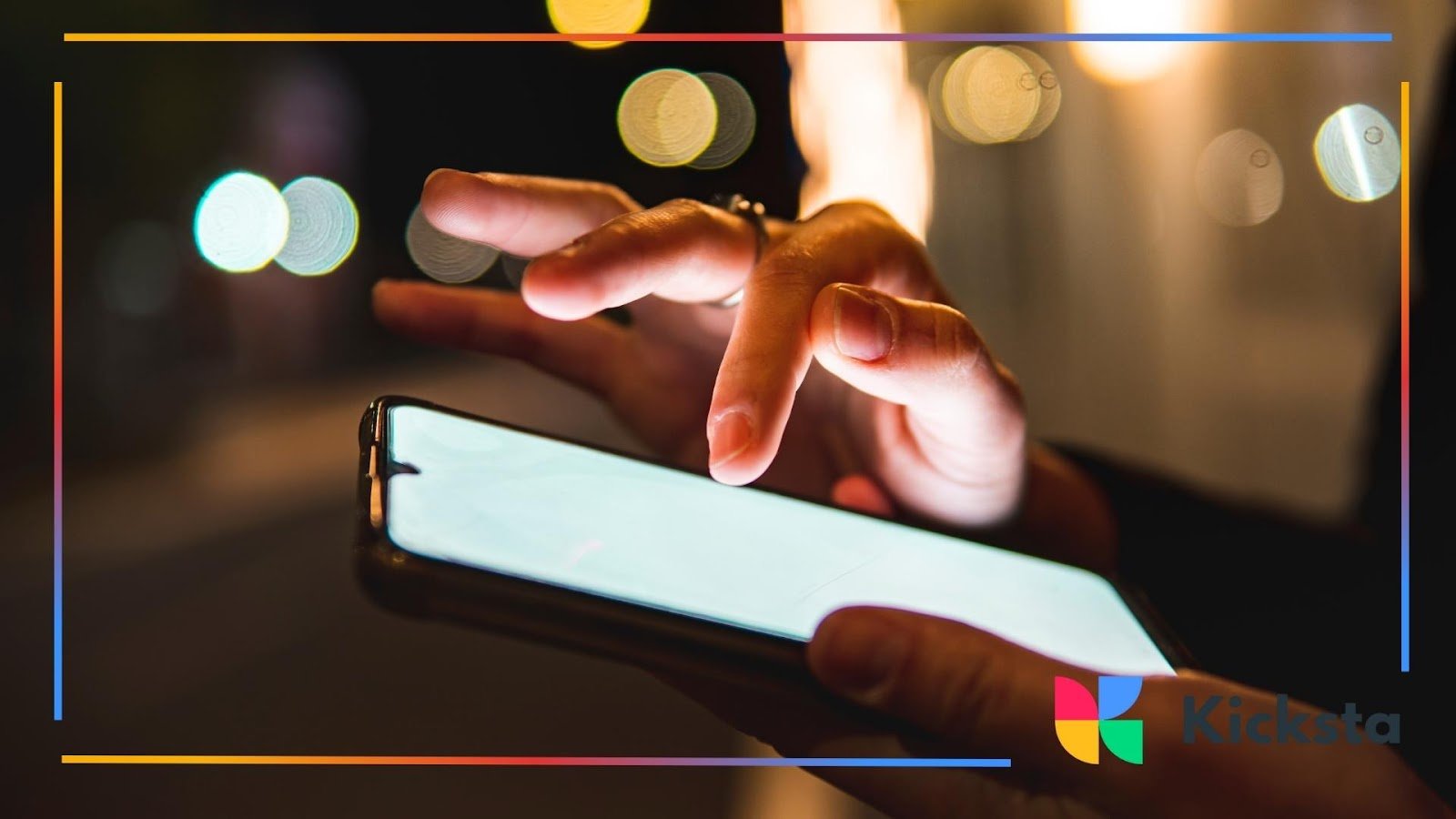 Close-up of hands using smartphone at night with glowing screen, symbolizing social media engagement and digital connectivity.