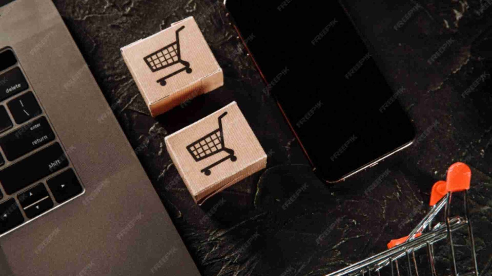 Wooden blocks with shopping cart icons placed near a laptop and smartphone, showing Instagram’s role in online shopping.