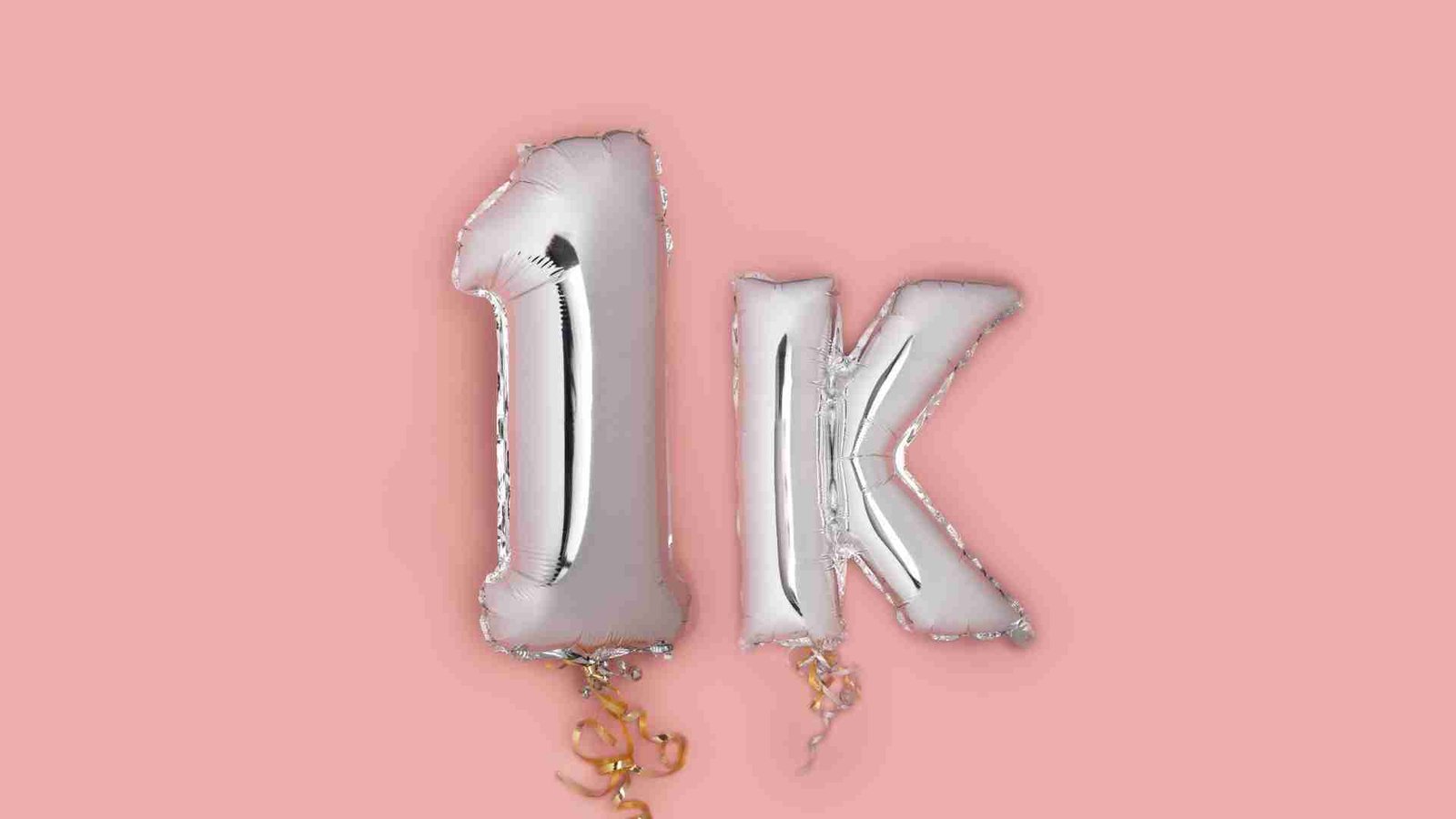 Silver 1k balloons representing Instagram follower milestone achievement.