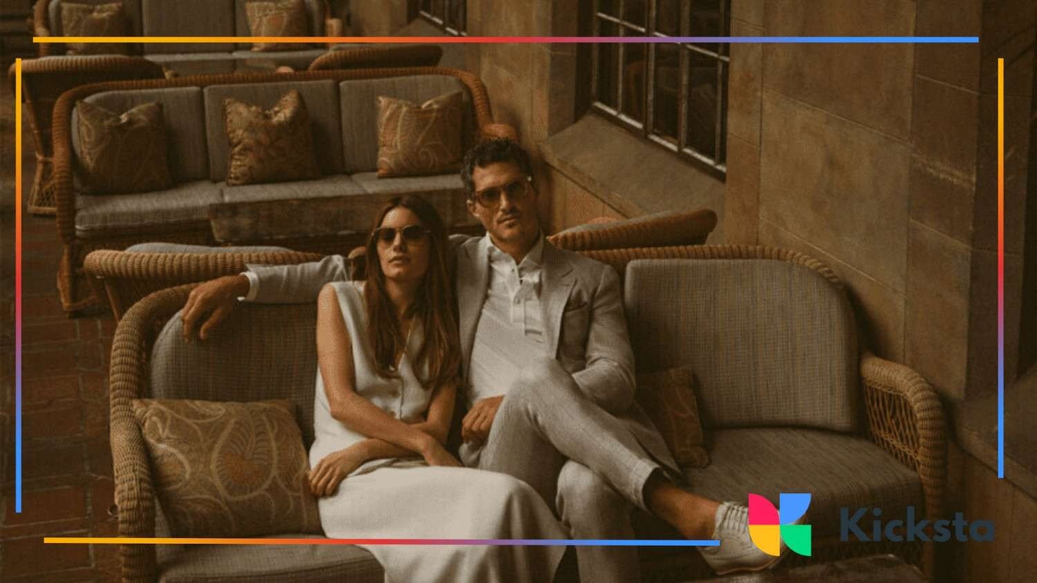 classy man and woman sitting on the coach