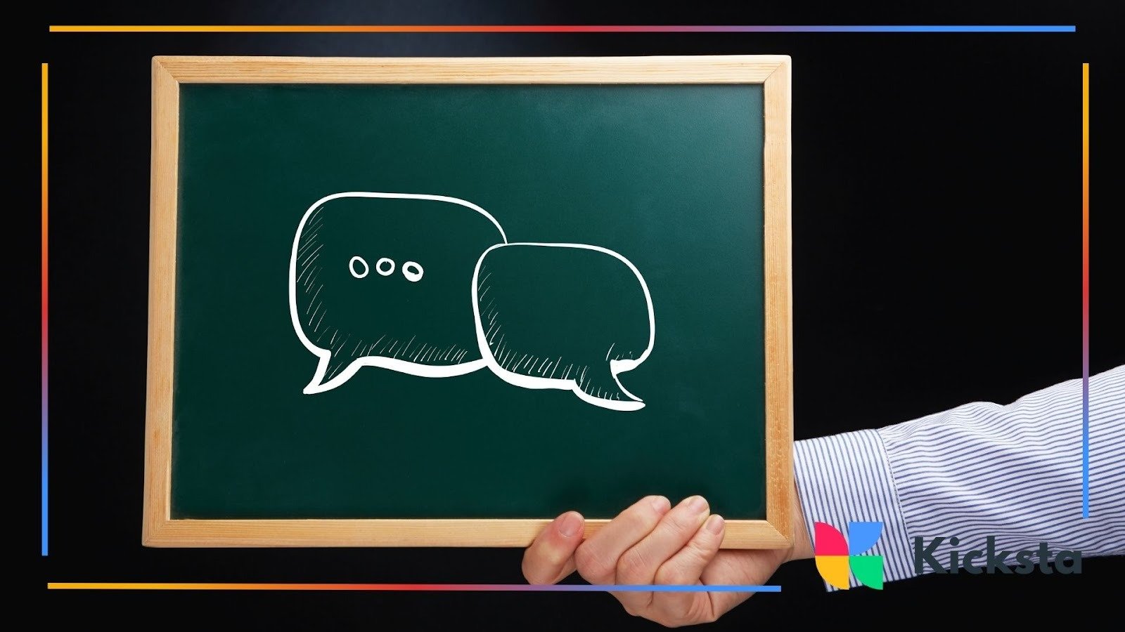 Hand holding chalkboard with illustrated speech bubbles, symbolizing communication, messaging, and social media conversation.