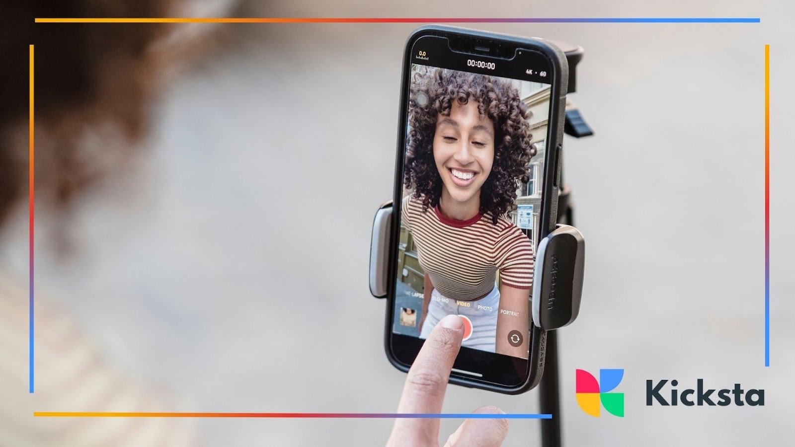 Smiling influencer recording Instagram video on smartphone tripod, symbolizing vlogging, personal branding, and social media content creation.