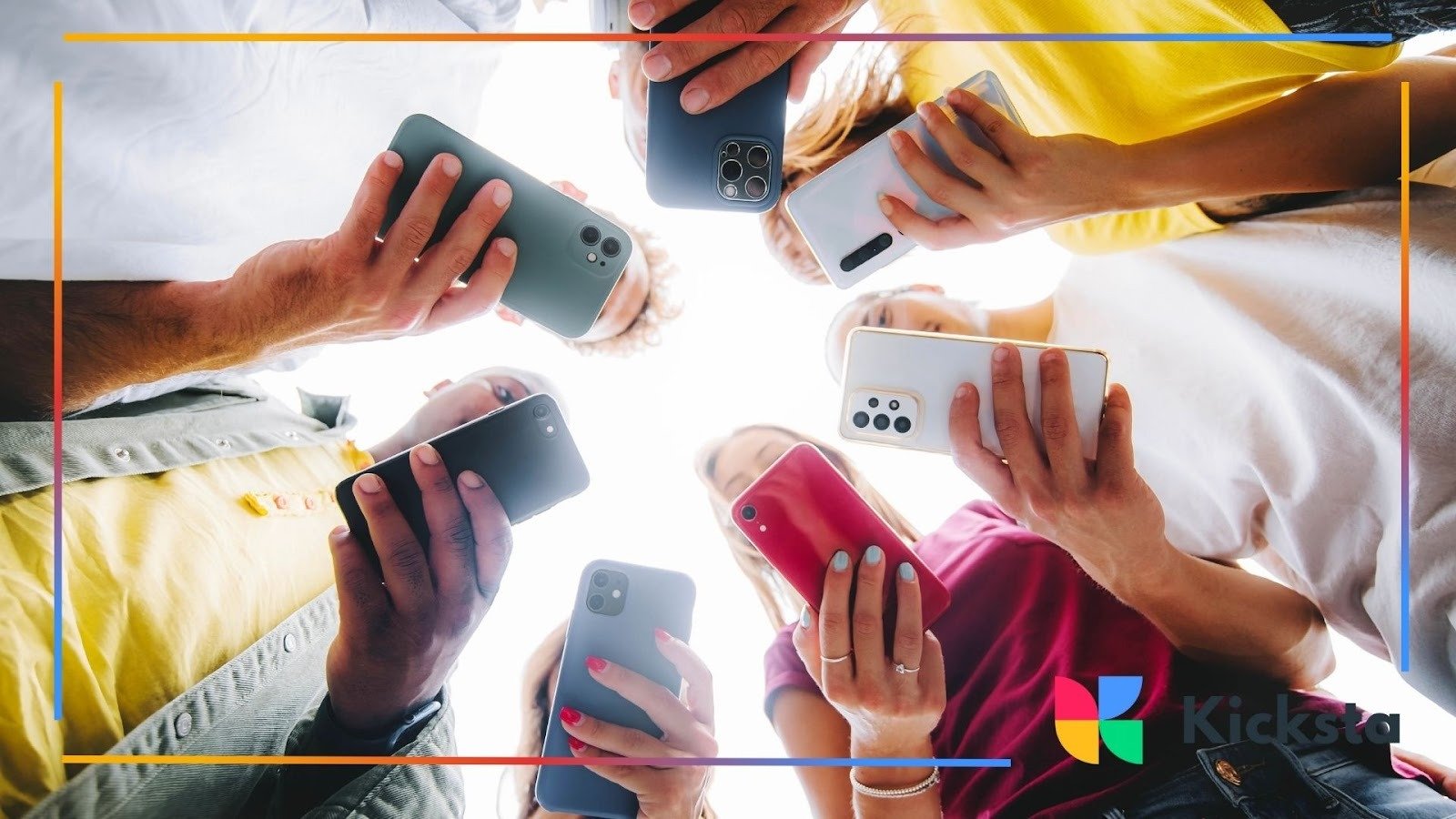 Group of friends holding smartphones in circle from below, representing social media connection, mobile community, and digital culture.