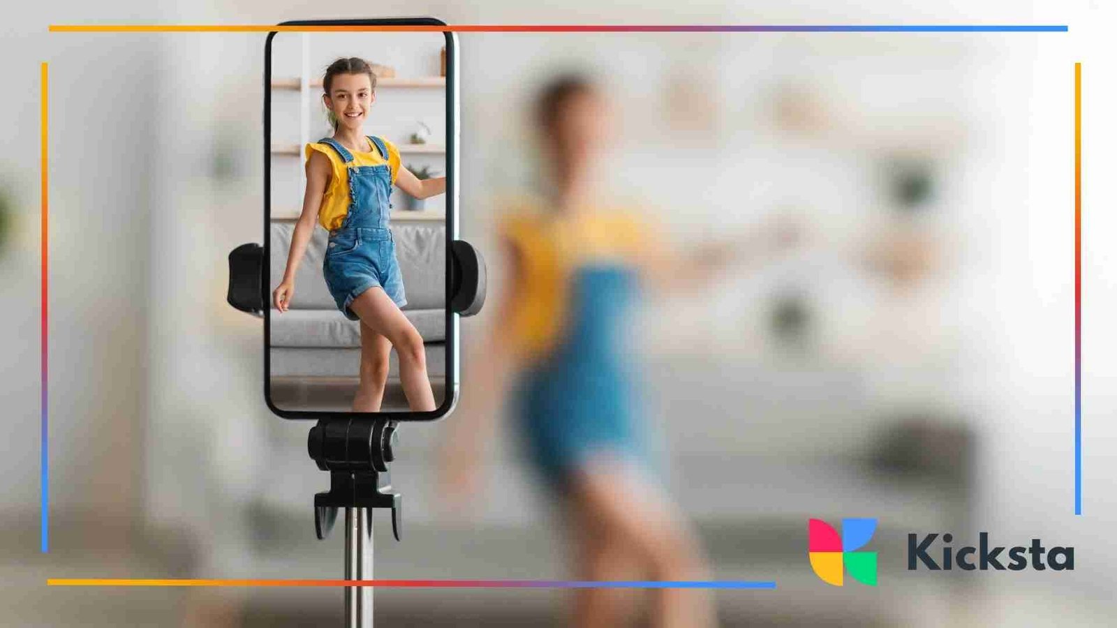 Smartphone on a tripod recording a young girl dancing in a bright living room.