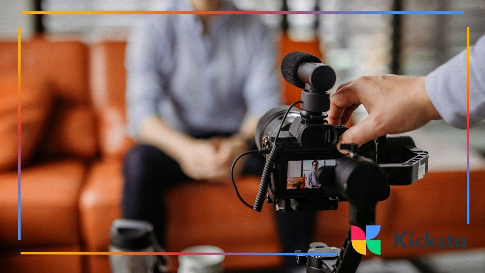 Professional camera recording interview with man on sofa, representing video content creation, influencer marketing, and social media production.