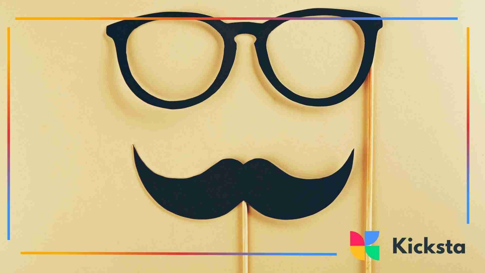 Paper cutouts of black glasses and a mustache on sticks against a beige background, resembling a playful disguise prop setup.