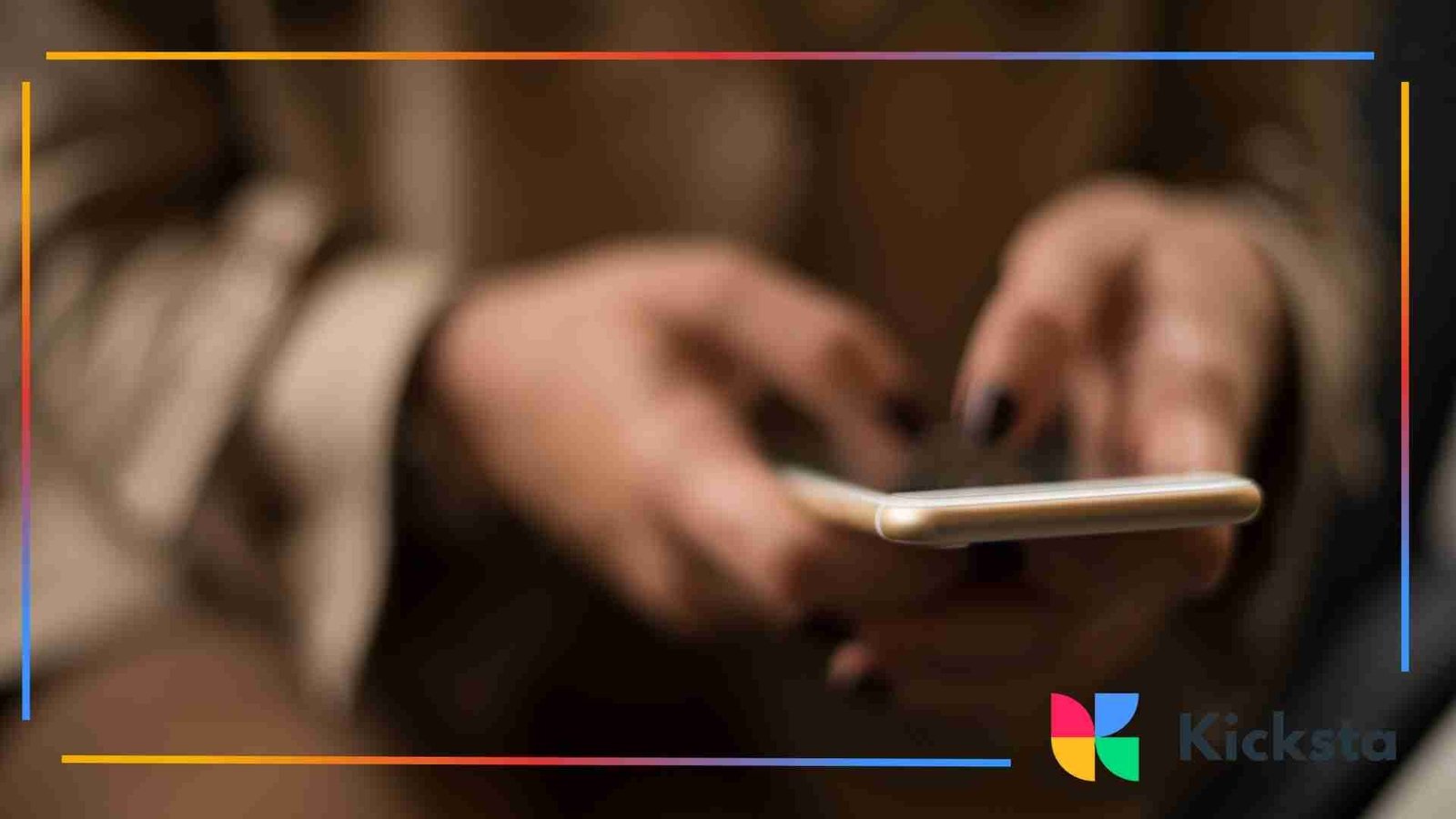 Close-up of hands typing on a smartphone with a soft, blurred background.