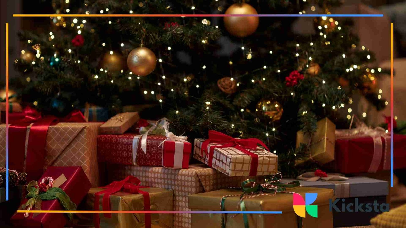 Wrapped Christmas gifts in red and gold paper arranged under a decorated tree with warm holiday lights.