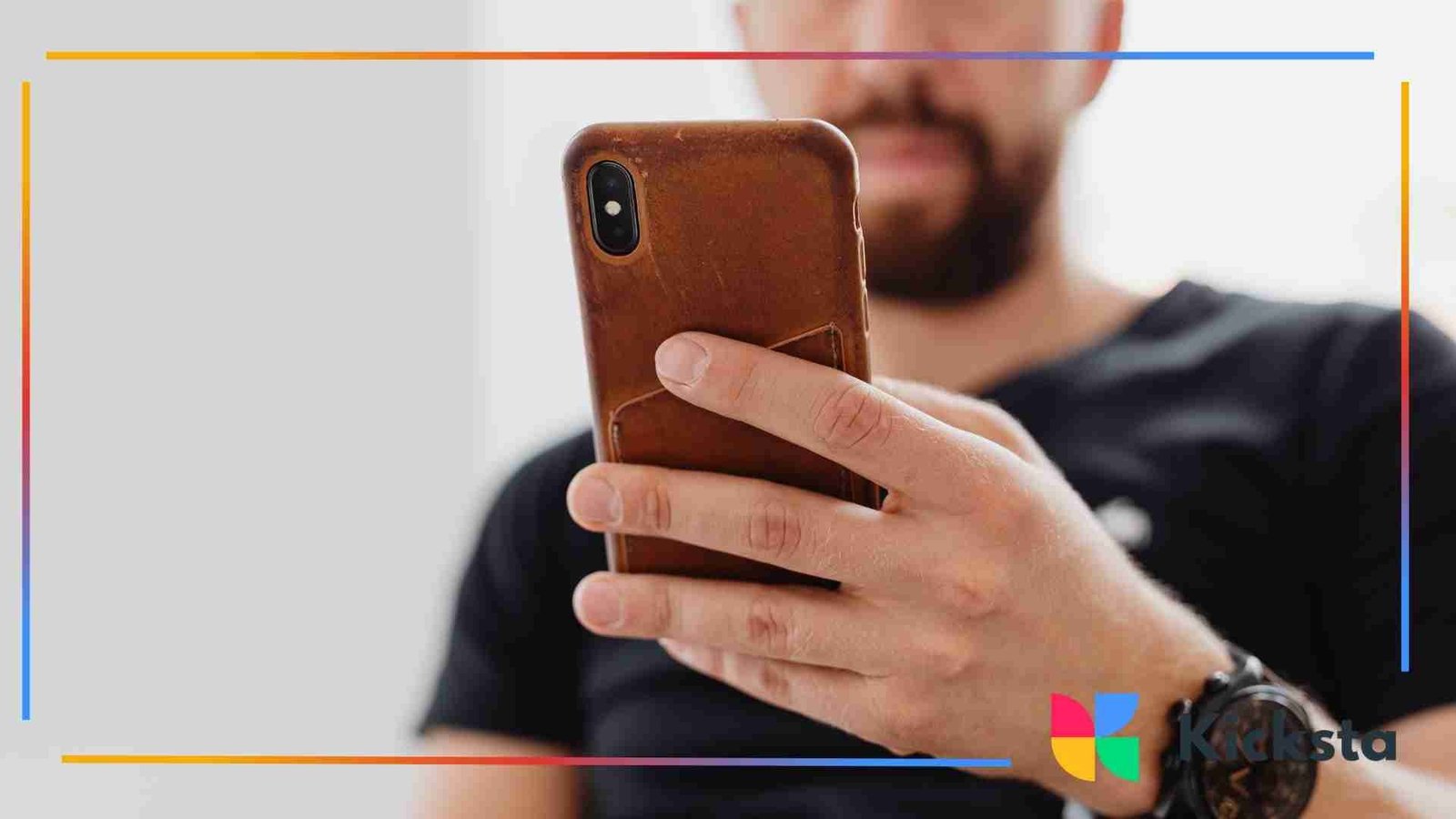 Close-up of a person holding a smartphone in one hand.